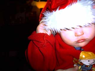 Little man in santa hat.