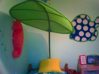 Leaf canopy over bed.